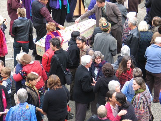 closeup of scattering of petals on the coffin
